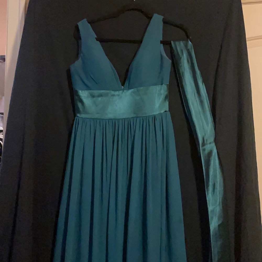 Dark green bridesmaid dress.